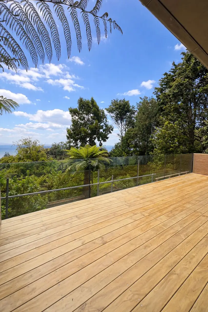 Frameless glass deck balustrade with black spigots, Auckland
